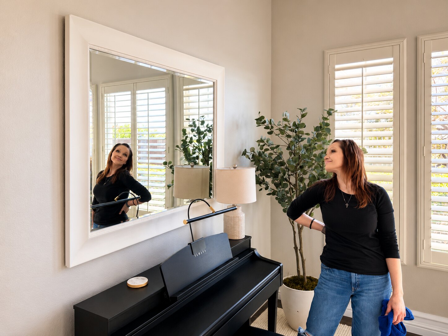 Kristen standing beside Client E’s completed mirror