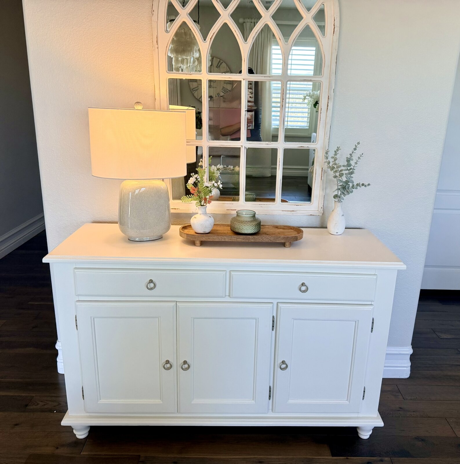Client E's cabinet restored in warm white and staged in her home