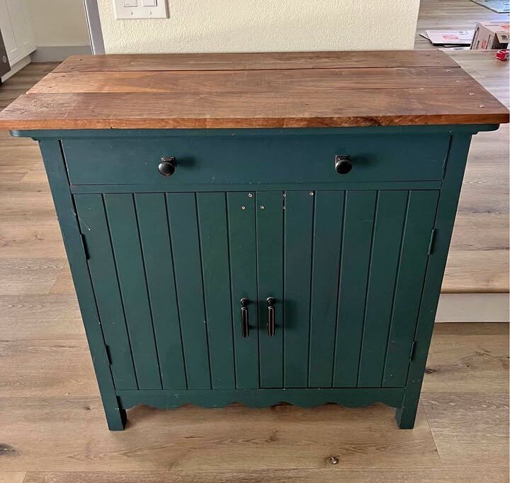 Green cabinet before extensive repairs and redesign